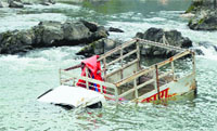 A tempo which fell into the Suketi rivulet in Mandi on Monday. Photo: Jai Kumar