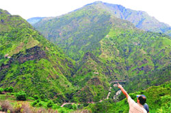 A villager points towards a mining site at Baneuti in Shimla. Tribune photo: Amit Kanwar
