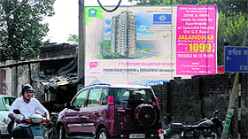 A hoarding promoting the HIG apartments at the Old Jail site installed by PUDA in Jalandhar on Saturday. 