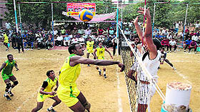 Players in action during a volleyball match;