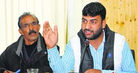 Public Health Engineering and Joint Employees Association president Sajad Ahmad Parry addresses a press conference in Srinagar on Tuesday.
