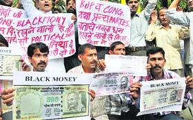 Activists of the Shiv Sena and Dogra Front protest over the black money issue in Jammu on Tuesday.