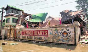 A file photo of a school submerged in the floodwaters at Jawahir Nagar in Srinagar.
