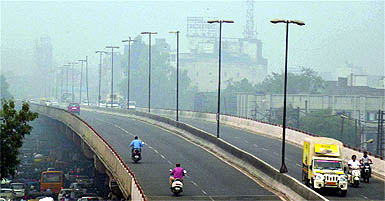 Commuters have a tough time as a blanket of smog engulfs Ludhiana on Tuesday. 