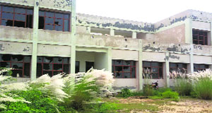 A view of the incomplete District Institute of Education and Training building with broken window panes and peeled-off plaster at Barkandi village in Muktsar district.