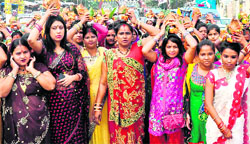 Women devotees hold a Kalash yatra as part of Chatth festivities in Haridwar on Tuesday. Tribune photo