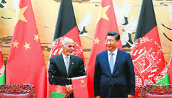 Chinese President Xi Jinping (R) with Afghan President Ashraf Ghani in Beijing on Tuesday. AFP
