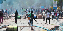 Hundreds of demonstrators clash with police in Burkina Faso capital Ouagadougou on Tuesday. AFP