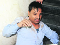 Rajesh Kumar, cashier of Swani Motors, who was looted by robbers in Amritsar on Wednesday