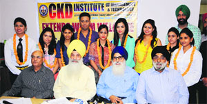 CKD president Charanjeet Singh Chada and management officials with the meritorious students who were honoured at a programme in Amritsar on Monday