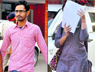 Two of the accused, Deepak Sharma and his wife Honey, being taken to the Mohali court on Wednesday. 
