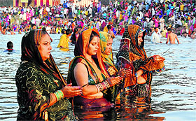 Devotees offer prayers at the lake in Sector 42, Chandigarh, on Wednesday.