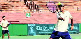 Naresh and Krishna in action during a doubles matches at the CLTA, Sector 10, Chandigarh, on Wednesday.
