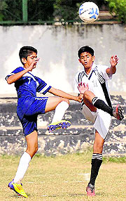 Players of the YPS and Tribune Model School in action during a match in Chandigarh on Wednesday, 