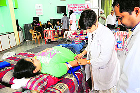 A volunteer donates blood during a camp at the Student Centre, Panjab University, on Wednesday. 