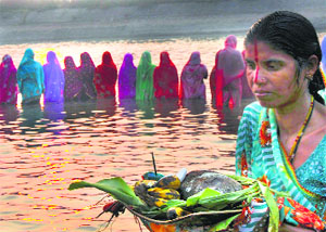 Devotees pray to the Sun God during Chhath Puja in Karnal on Wednesday. All roads led to water bodies as thousands offered Sandhya Arghya. The final rituals will be at sunrise on Thursday.