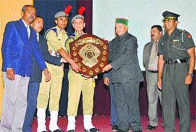 Chief Minister Virbhadra Singh presents an award to the students of the Rashtriya Military School on the occasion of their 89th annual day at Chail
