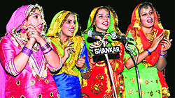 Girls perform giddha in dark due to a fault in floodlights during the inaugural ceremony of the 31st Servo Indian Oil Surjit Hockey Tournament in Jalandhar on Wednesday