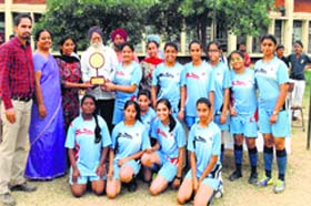 Winners of the LSSC Football Tournament with the trophy in Ludhiana
