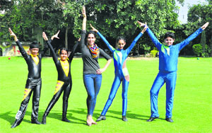 Happy feet: Jas K Shan with her team of youngsters