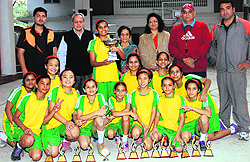 Players of The Doon Girls School with the winning trophy of the 7th Tek Chand Memorial Basketball Tournament at the school in Dehradun on Wednesday