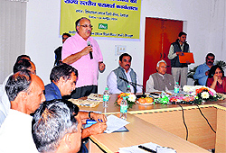 Mahendra Singh Kunwar, chairperson of Himalayan Action Research Center, addresses mediapersons at a farmers workshop in Dehradun on Wednesday