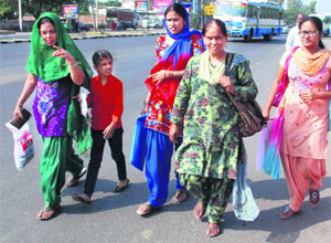 Commuters forced to walk to the bus stop near the Zirakpur flyover.