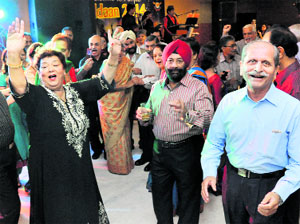 Retired Air Force officers of the 1966 batch dance during their annual get-together Udaan 2014 in Chandigarh on Thursday.