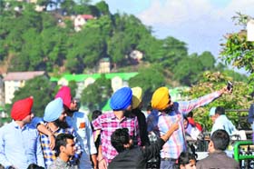 Selfie moments: Tourists enjoy a sunny day in Shimla on Thursday