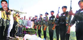 Jawans pay last respect to martyr Rajesh (inset) in Mandi on Thursday