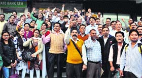 Bankers protest in support of their demands at Rajpur road in Dehradun on Thursday