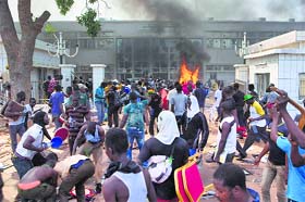 Emergency declared: Protesters set fire to the parliament building in Ouagadougou, capital of Burkina Faso, on Thursday