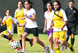 Players of St Kabir School and Saupins School in action during a match at New Public School, Sector 18, Chandigarh. A Tribune Photograph
