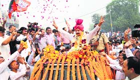 PWD Minister Rao Narbir Singh being welcomed in Gurgaon on Friday.