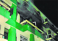 Smoke billows out from a hostel room of the Tanda college in Kangra on Thursday