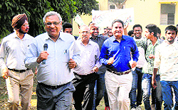 Students and teachers take part in a run at Arya College
