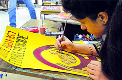 A girl takes part in a poster-making competition during the youth fest at Punjab Agricultural University on Friday