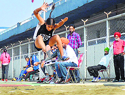 An athlete takes part in long jump
