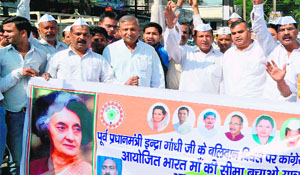 Former legislator Ambrish Kumar takes part in a march on the occasion of the 30th death anniversary of Indira Gandhi in Haridwar  on Friday. 
