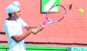 Jaskaran Riar in action during a tennis match at the CLTA courts in Sector 10, Chandigarh, on Saturday.