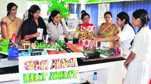 Students explain a model to visitors during the ICSE Inter-School Science Symposium at St Xavier's Senior Secondary School, Sector 44, Chandigarh, on Saturday.