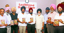 Members show the Punjabi translation of Paradise Lost during the third meeting of Ludhiana Book Club