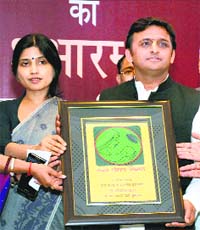 UP CM Akhilesh Yadav with his wife Dimple Yadav release the logo of State Nutrition Mission in Lucknow on Saturday