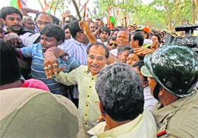 Police personnel try to detain WBPCC chief and MP Adhir Ranjan Chowdhury at Makra village in Birbhum on Saturday