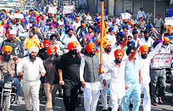 Activists of various Sikh bodies take out a protest march in Jalandhar on Saturday