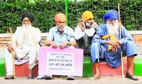 Victims under the banner of All India Sikh Conference seek justice in New Delhi on Friday.