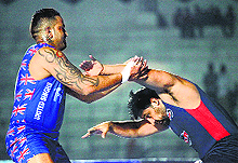 Sandeep Sandhu of United Singhs trying to stop Gurlal Singh of Royal Kings during their WKL match in Bhopal on Saturday
