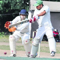A Subhadra Cricket Academy batsman plays a shot during a match in Nazar Khan Memorial Cricket Tournament at Rangers Ground in Dehradun on Saturday.