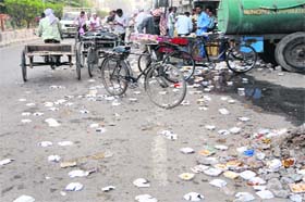 The MM road in Amritsar littered with paper plates after a langar programme was organised on Sunday