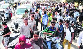 Candidates come out of an examination centre at the Mall Road in Bathinda on Sunday.